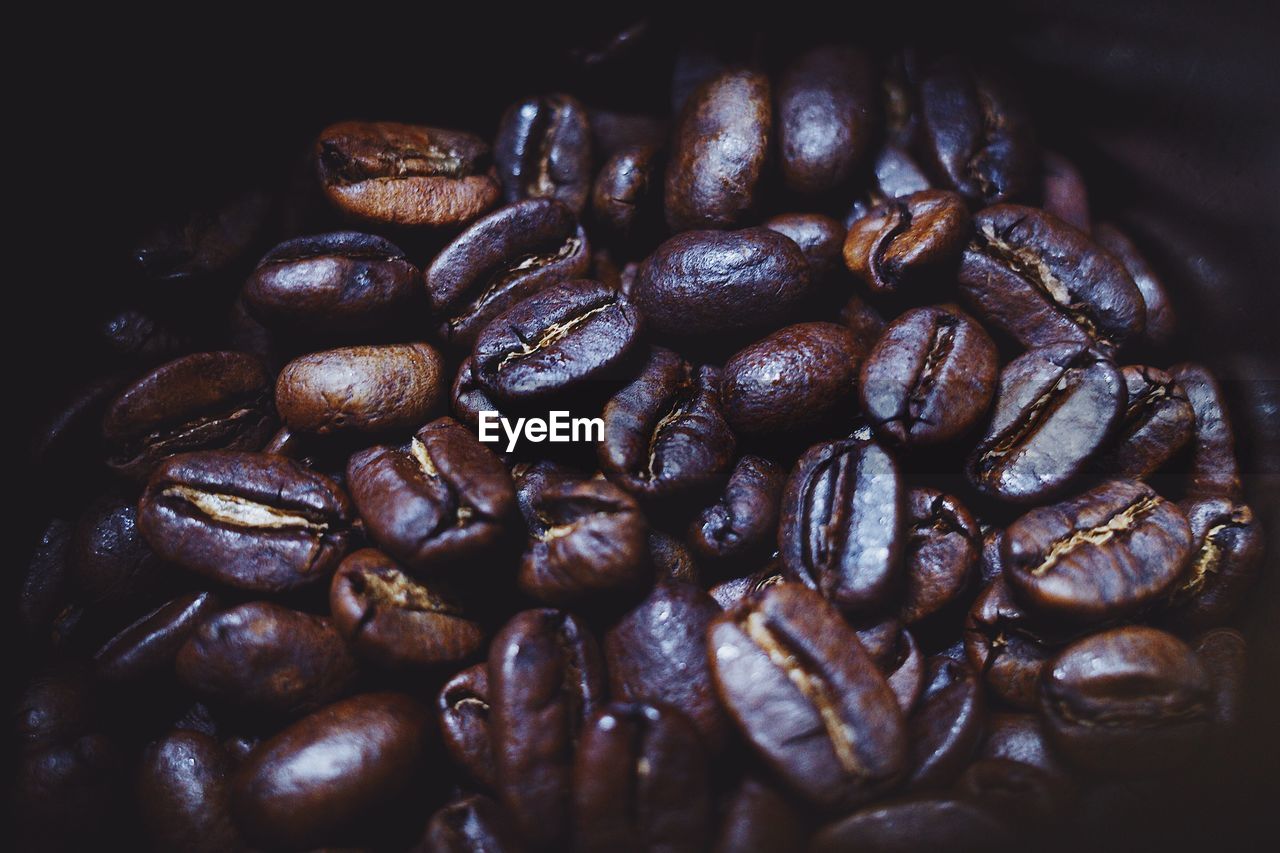 CLOSE-UP OF COFFEE BEANS IN THE BACKGROUND