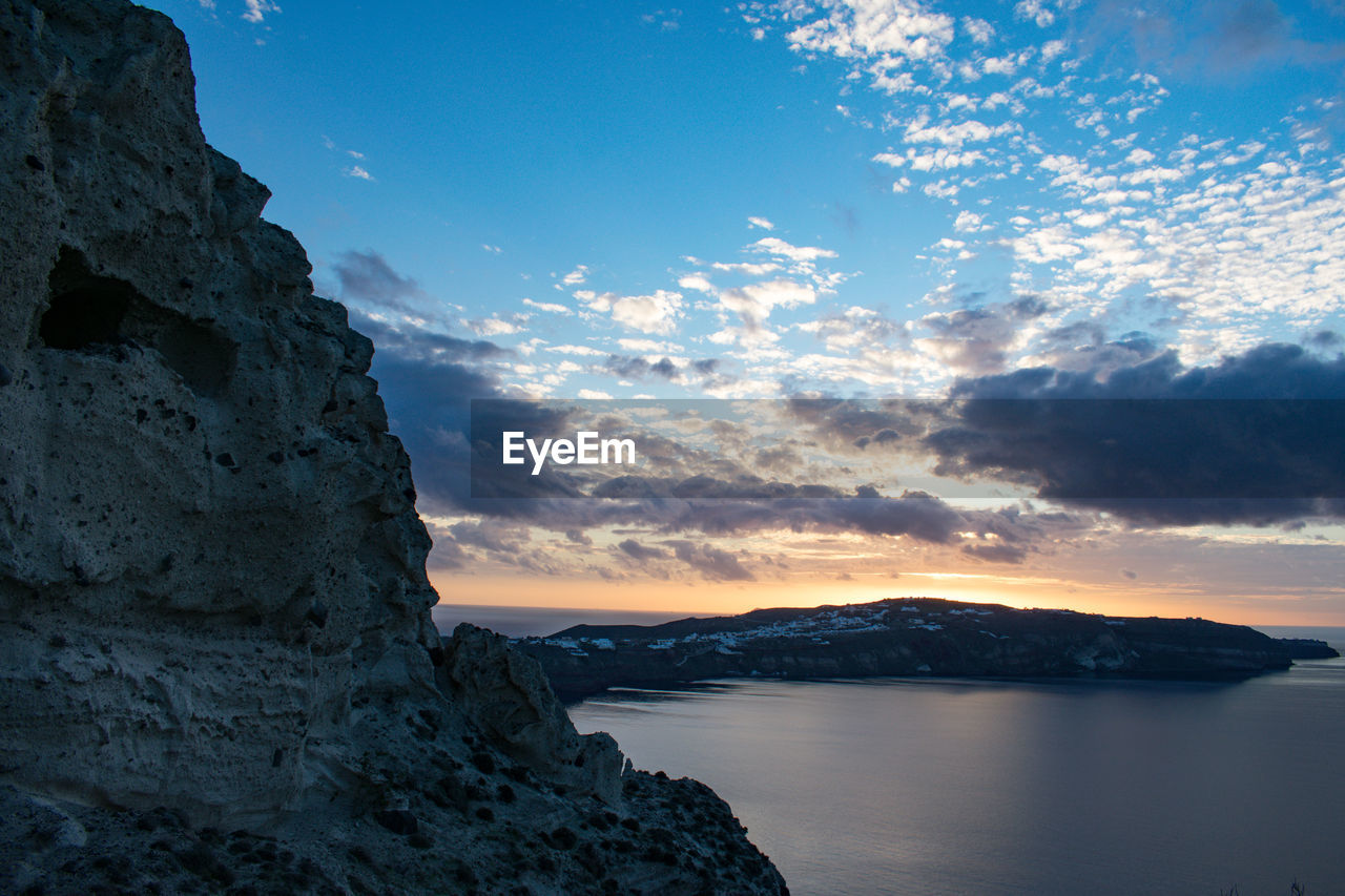 SCENIC VIEW OF SEA AND ROCKS AGAINST SKY