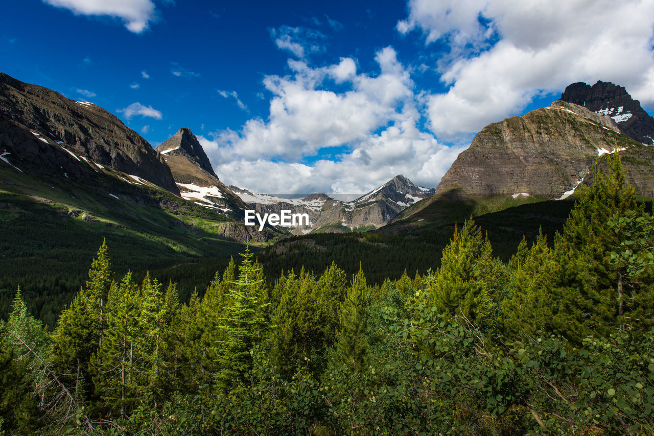 SCENIC VIEW OF MOUNTAINS AGAINST SKY DURING WINTER