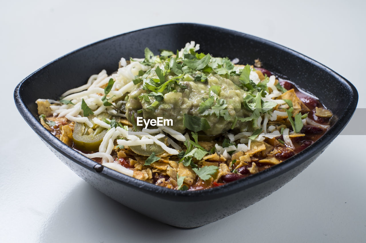 Food in bowl against white background