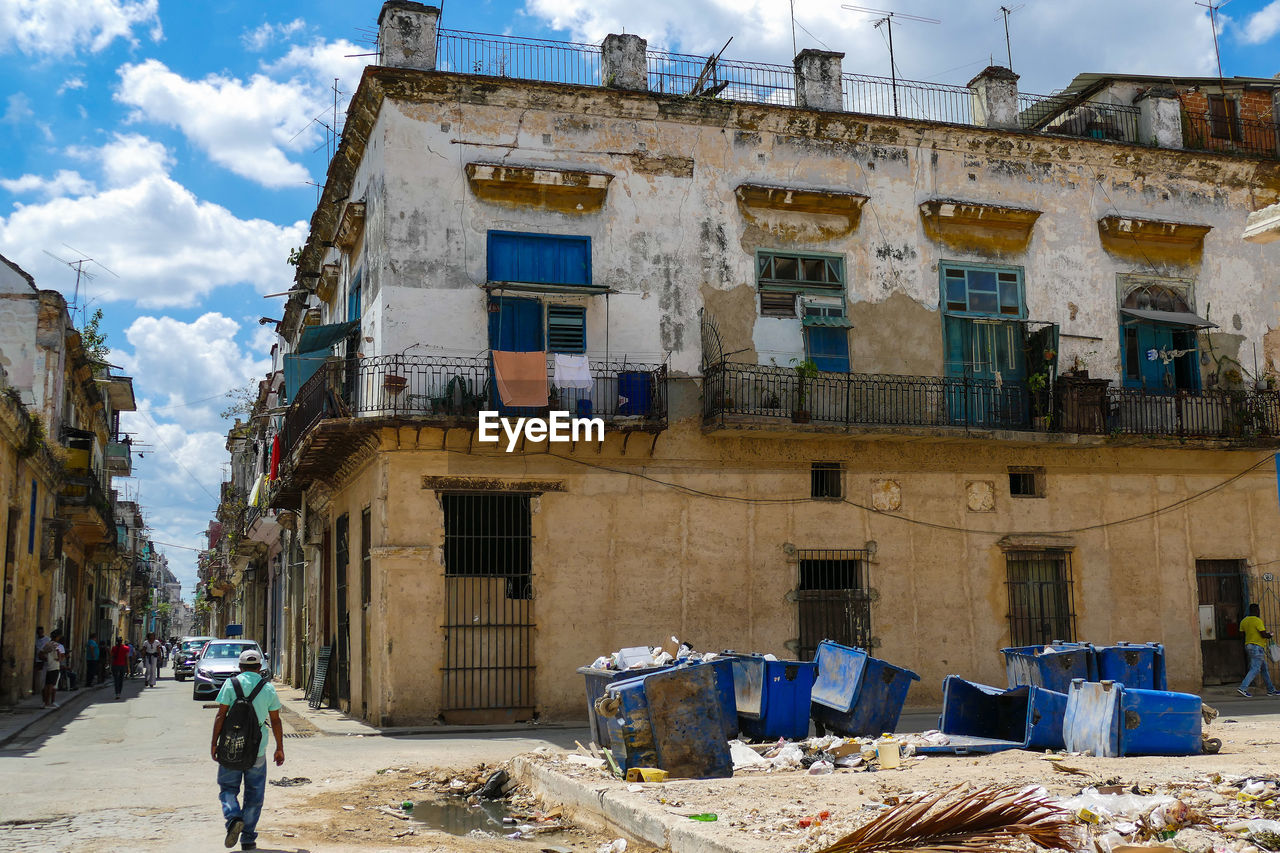 Havana street with old destroyed houses and garbage cans havana cuba 02/04/2018