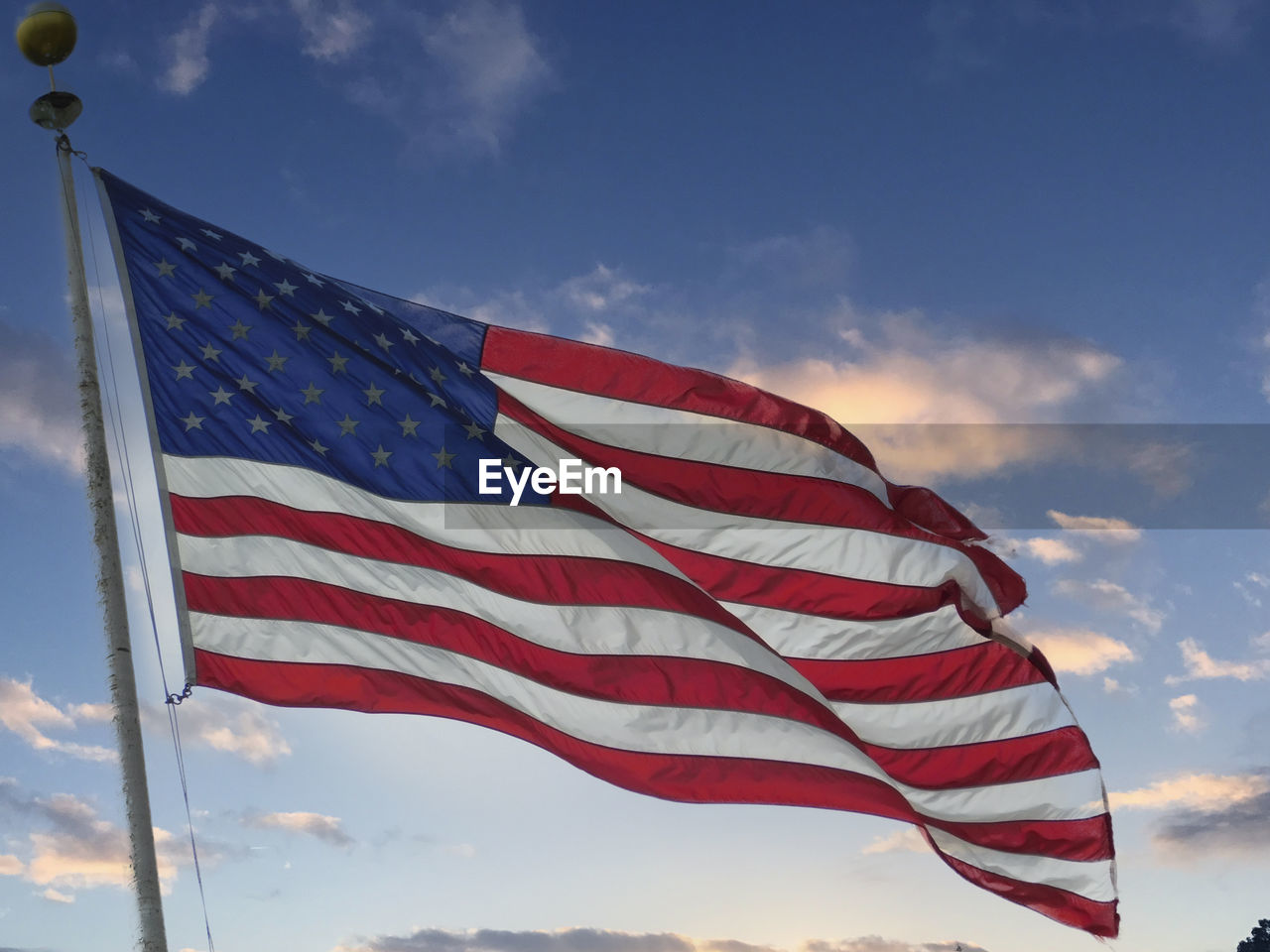 Low angle view of flag against sky