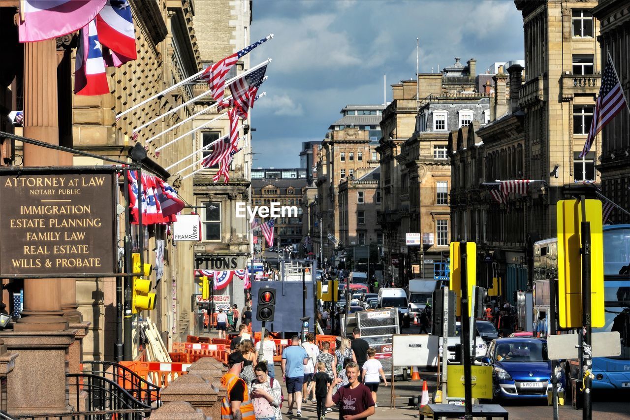 GROUP OF PEOPLE IN CITY STREET