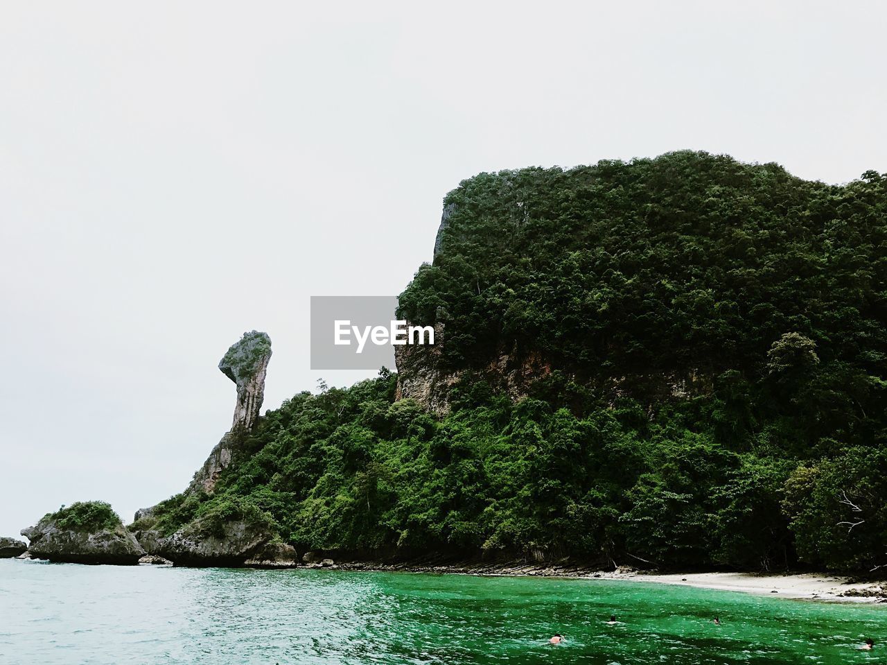 ROCK FORMATION BY SEA AGAINST SKY