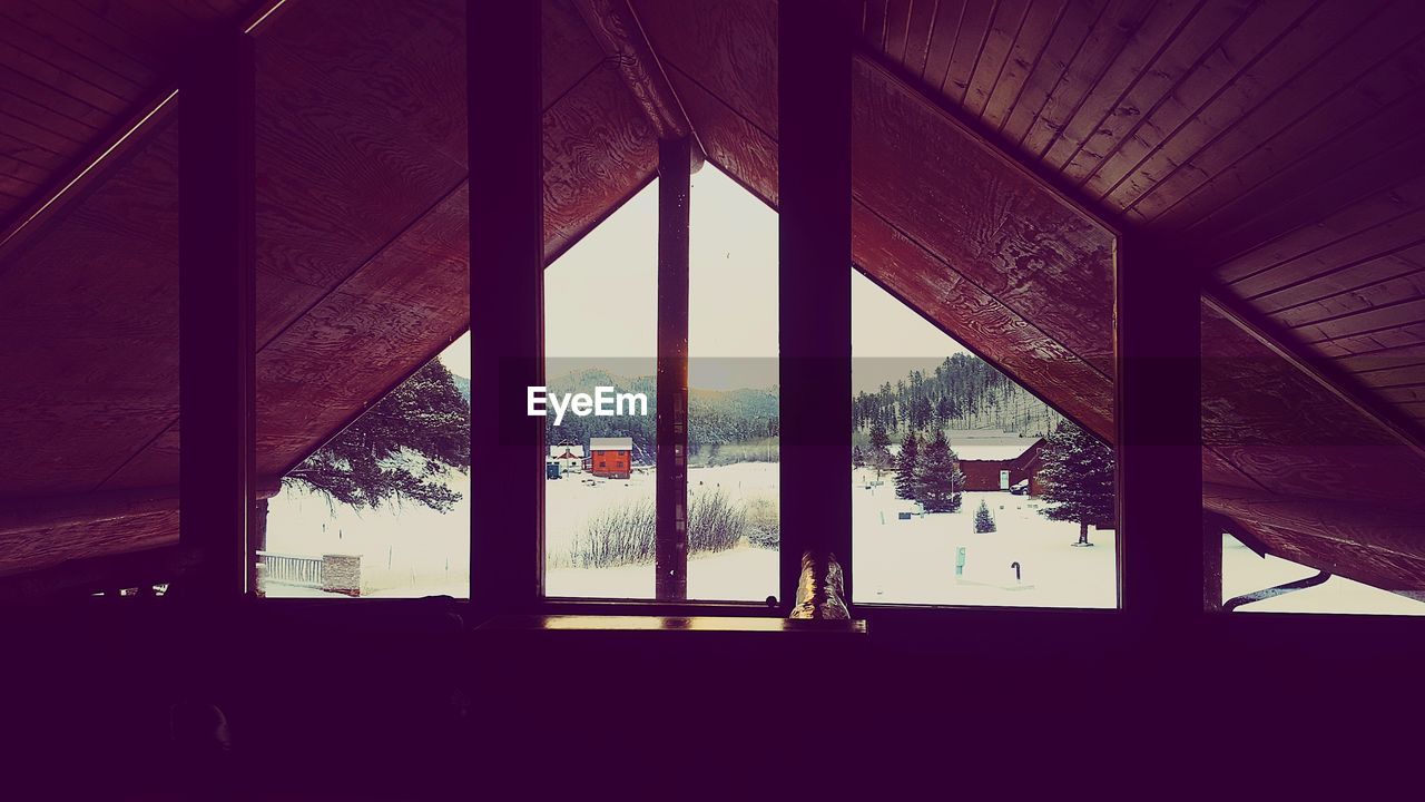 Winter sky seen through window of cabin