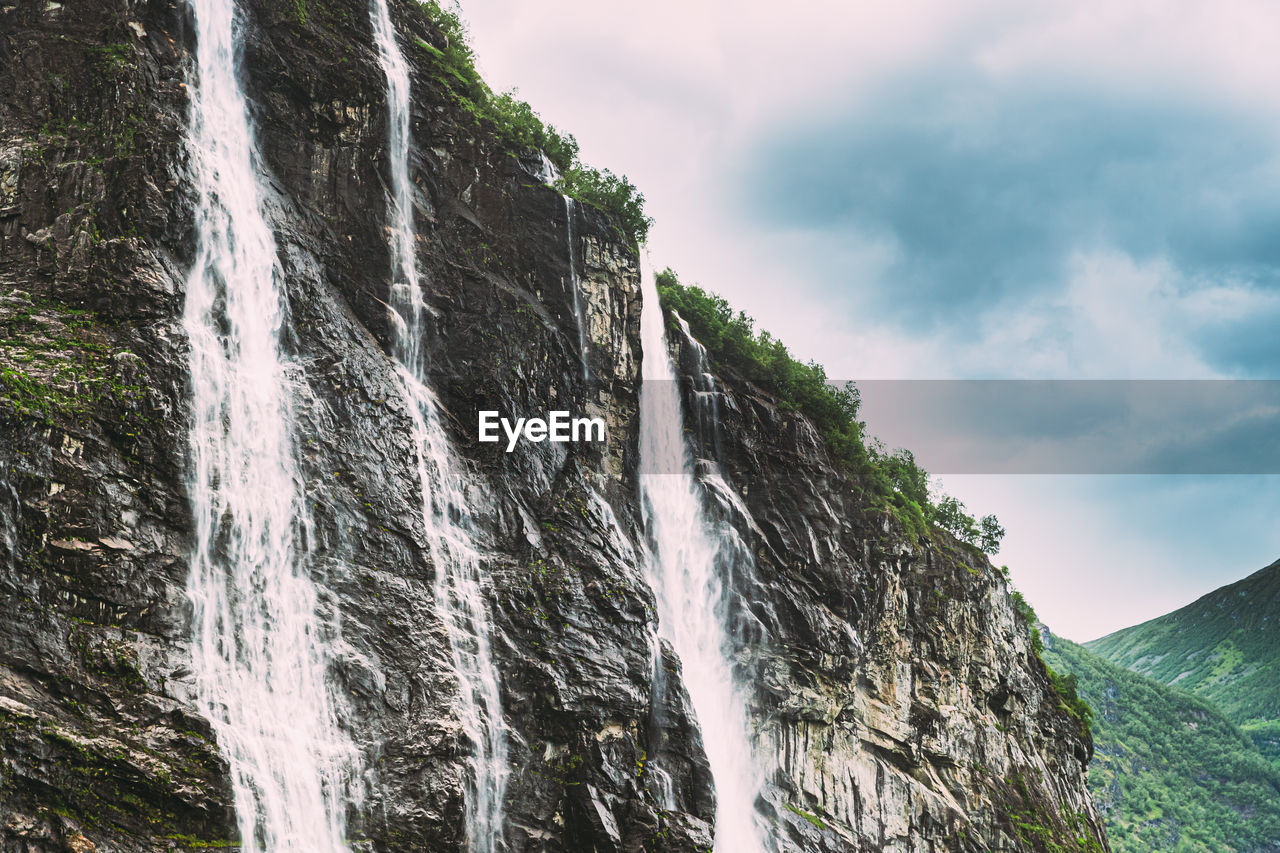 low angle view of waterfall in forest