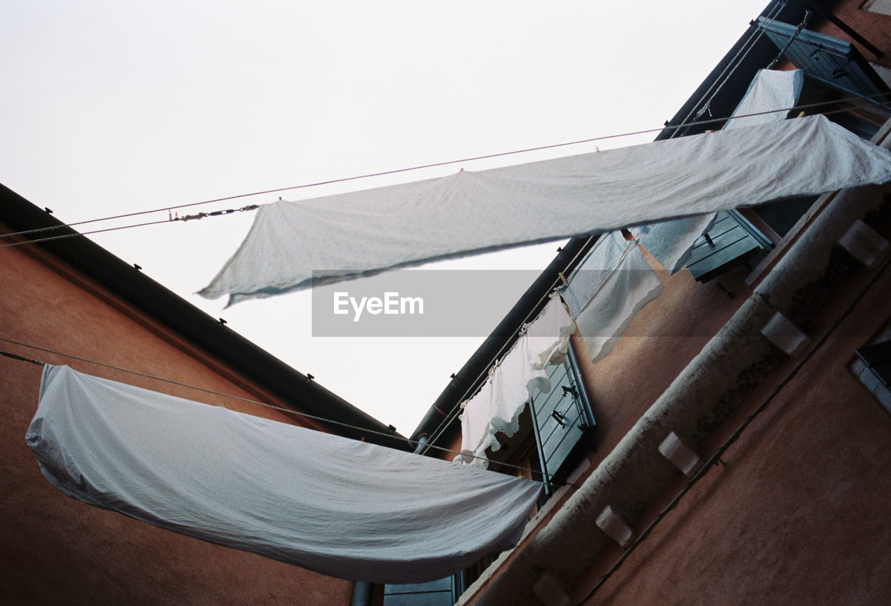 Low angle view of laundry drying outdoors