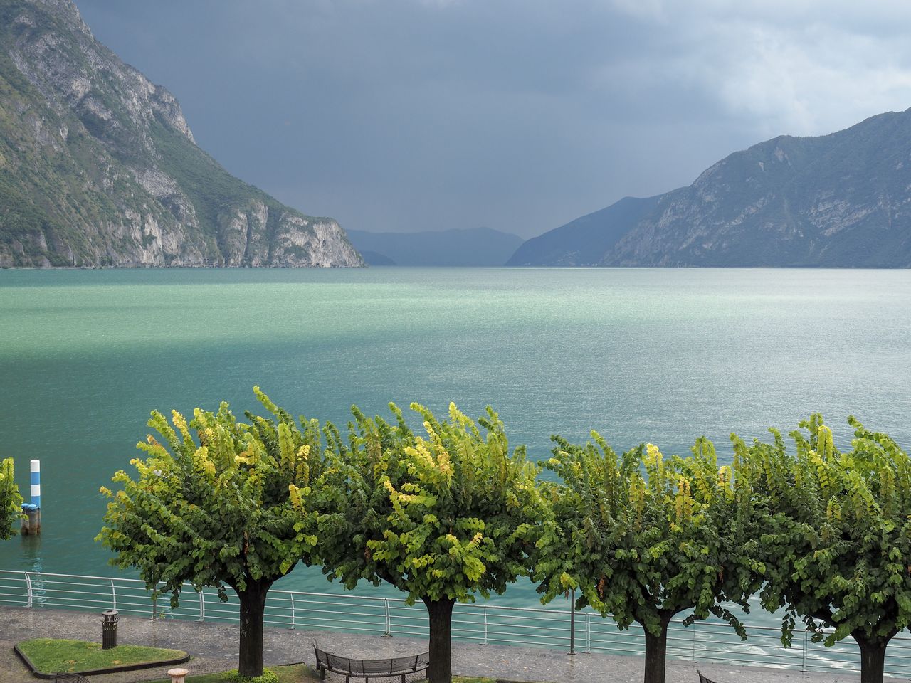 SCENIC VIEW OF LAKE AGAINST MOUNTAIN