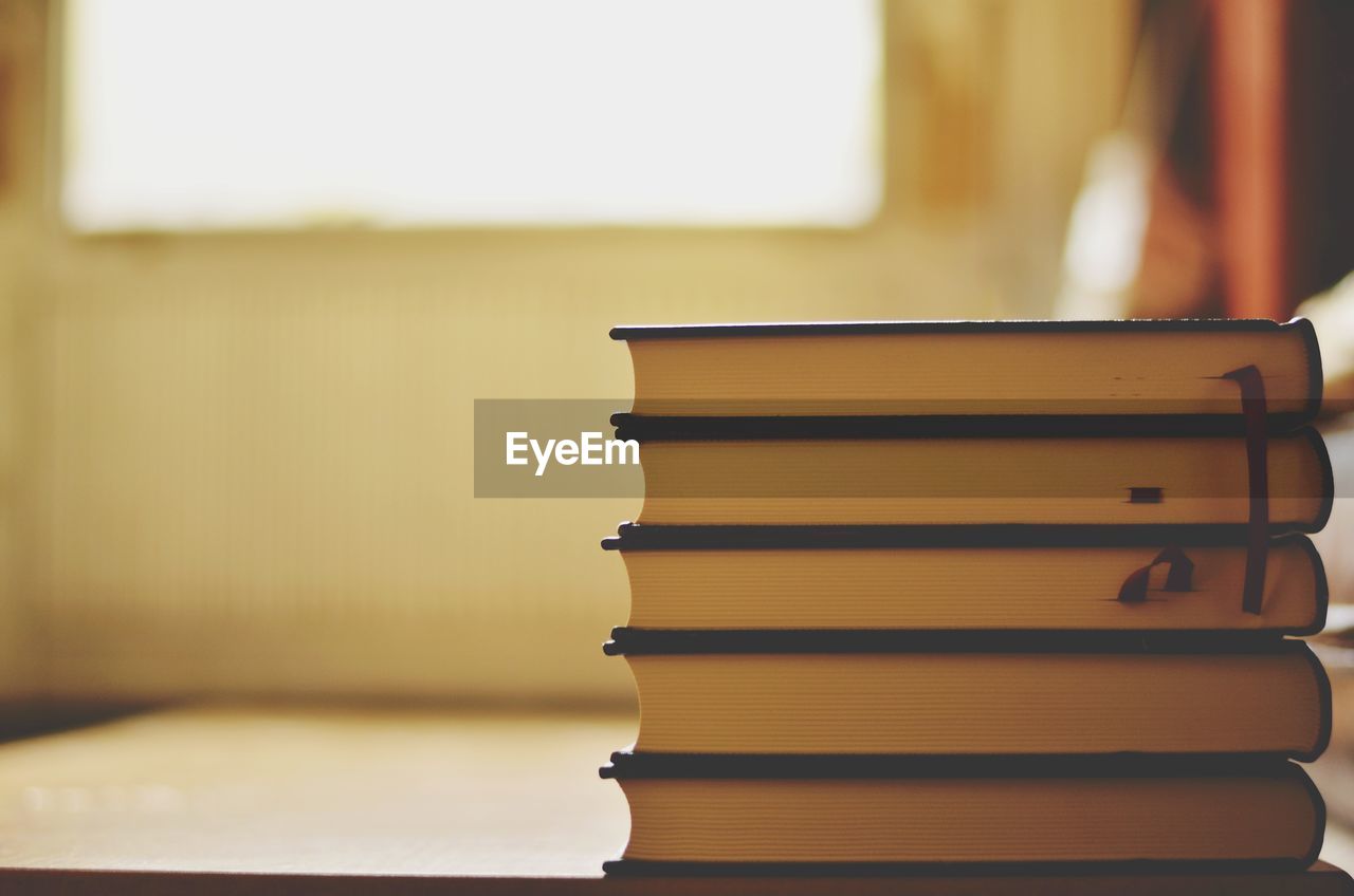 Close-up of stacked books on table