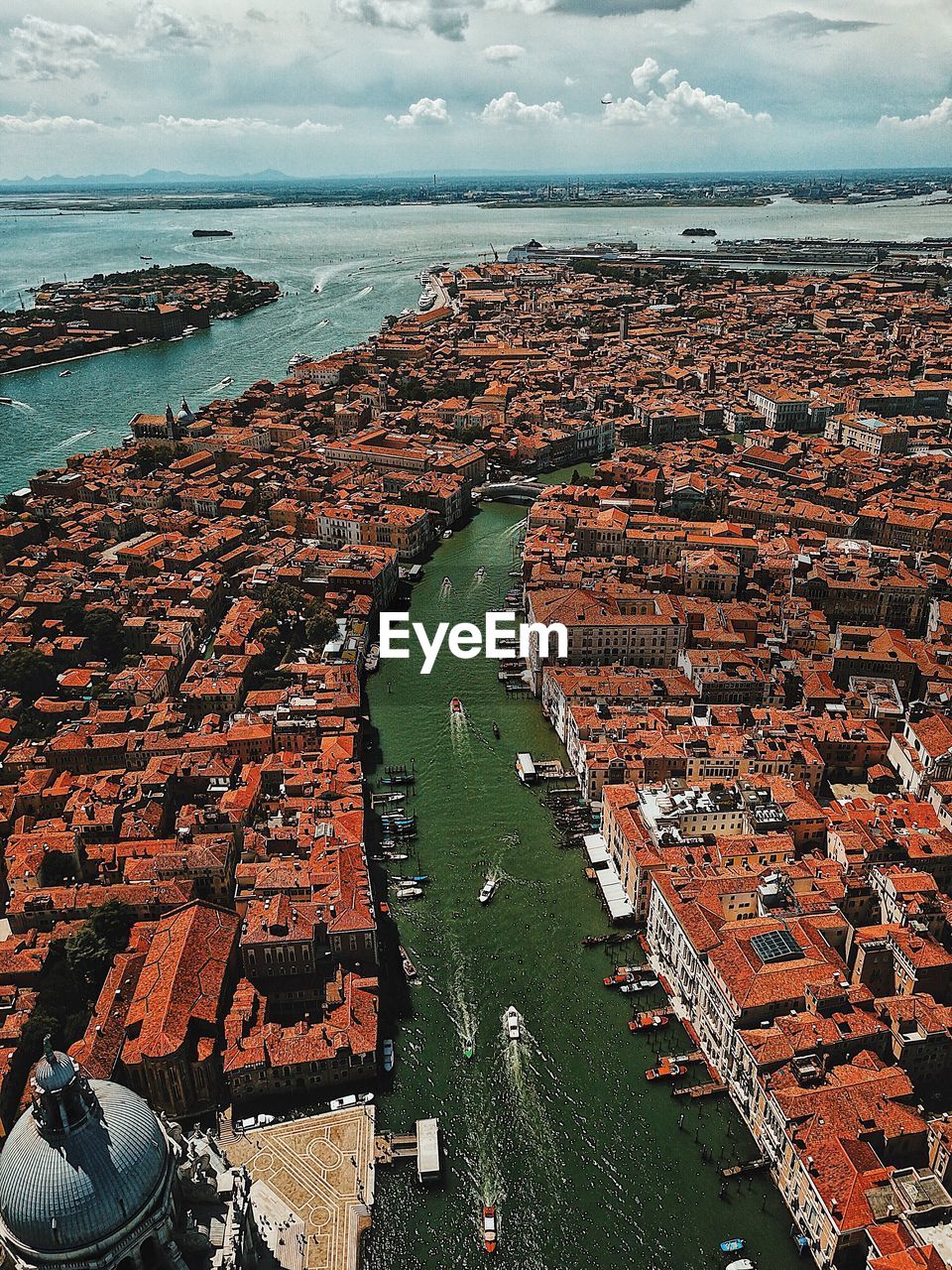 High angle view of sea and buildings against sky