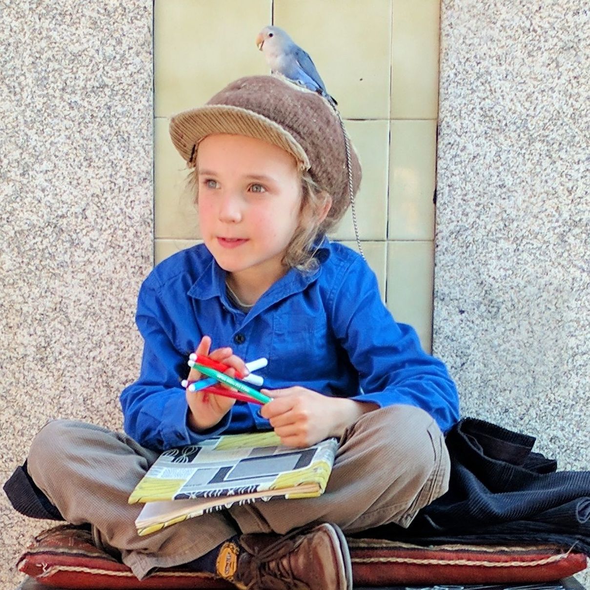 PORTRAIT OF BOY SITTING ON WALL