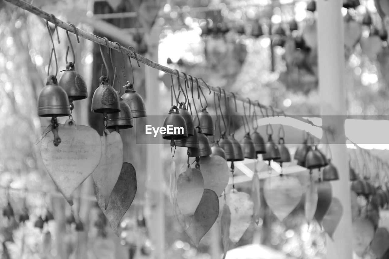 CLOSE-UP OF LIGHTING EQUIPMENT HANGING FROM METAL