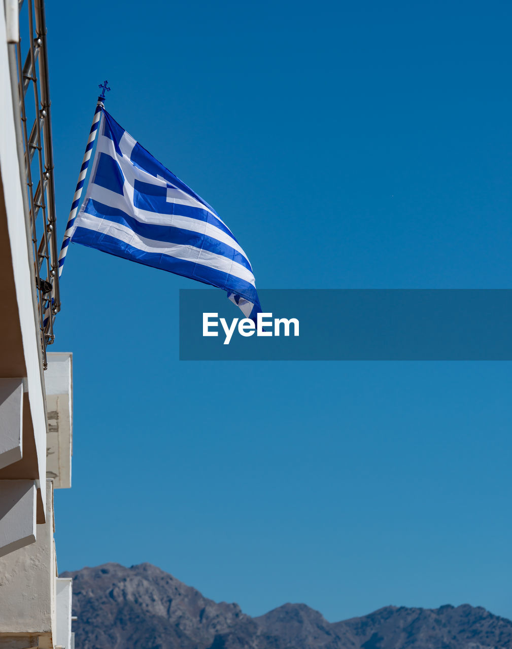 Greece flag on a building in kardamaina kos