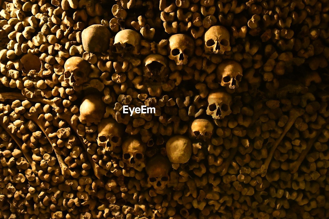 Full frame shot of human bones in catacombs