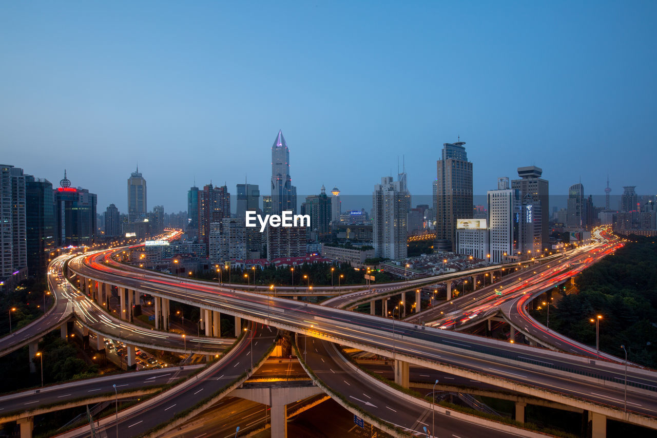 High angle view of light trails on road in city