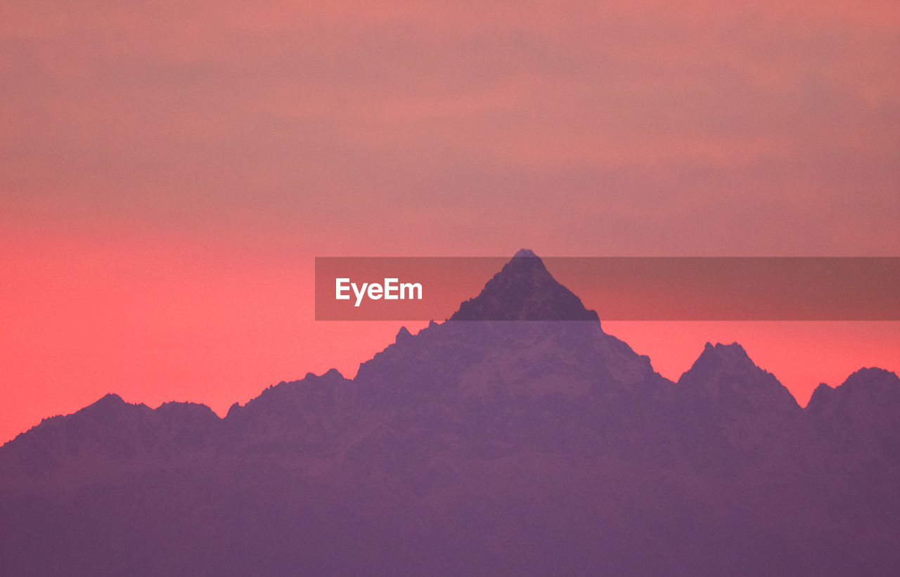 Scenic view of mountains against sky during sunset