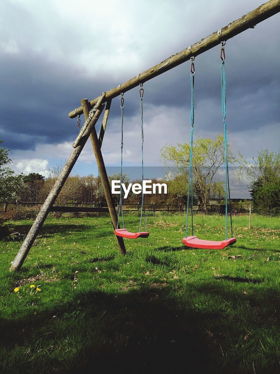CLOSE-UP OF PLAYGROUND AGAINST TREES