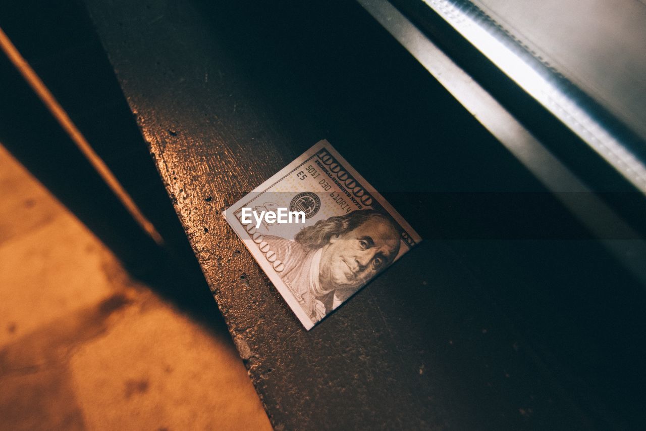 High angle view of currency on table