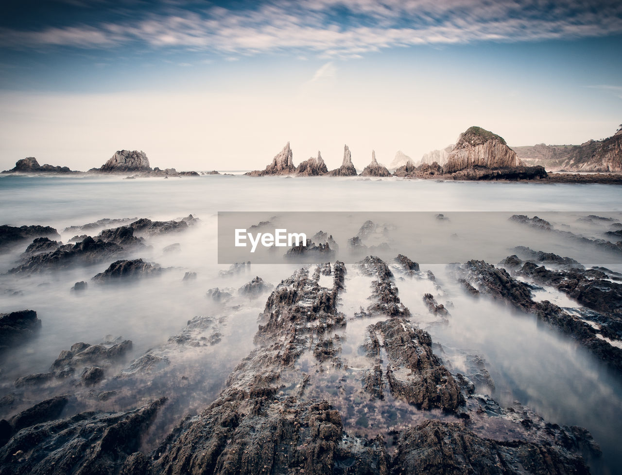 SCENIC VIEW OF ROCKS AGAINST SKY DURING SUNSET