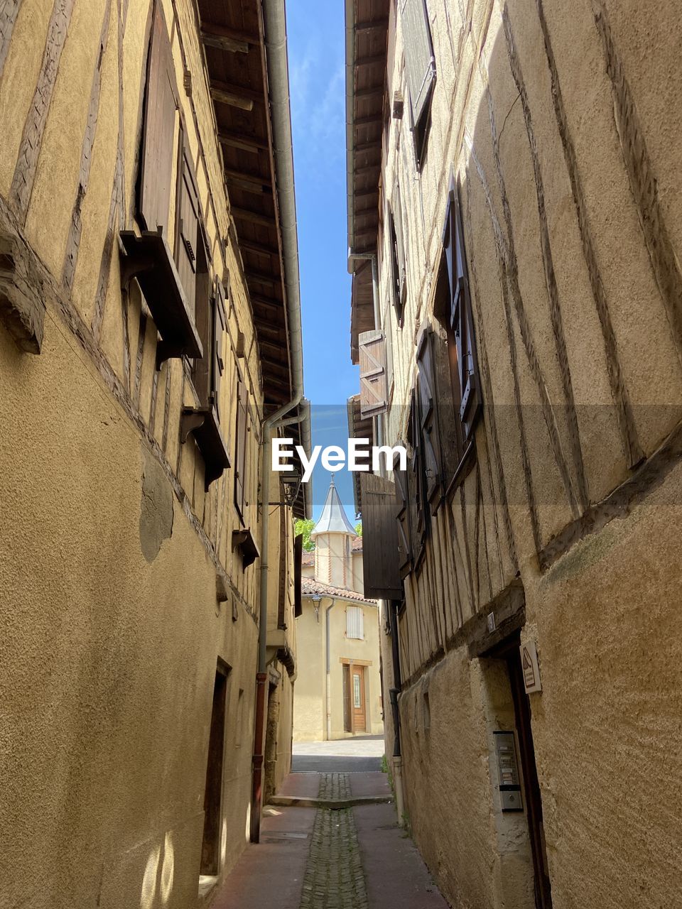 Narrow street amongst medieval houses in auch 