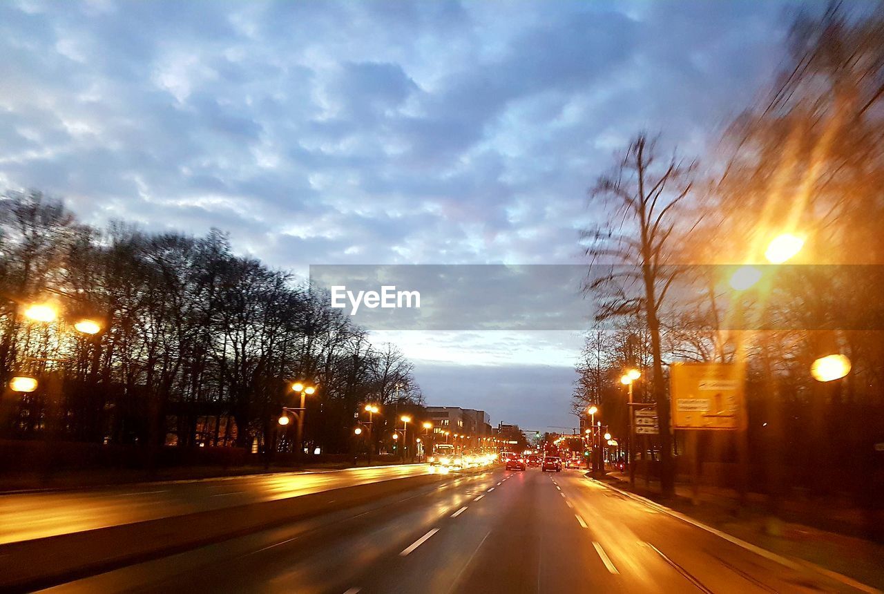 VIEW OF CITY STREET DURING SUNSET