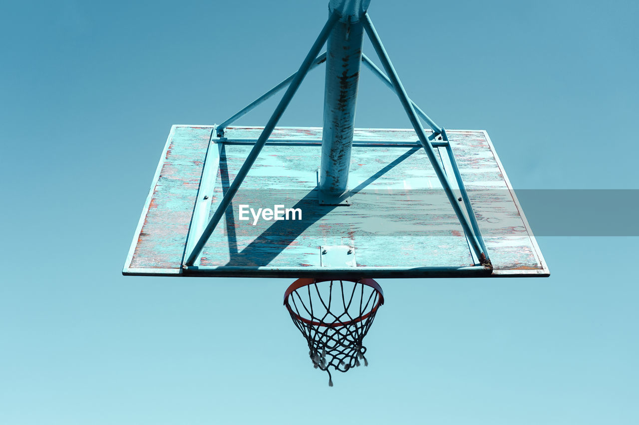 basketball, basketball hoop, blue, sports, sky, no people, clear sky, mast, net, low angle view, net - sports equipment, playground, nature, line