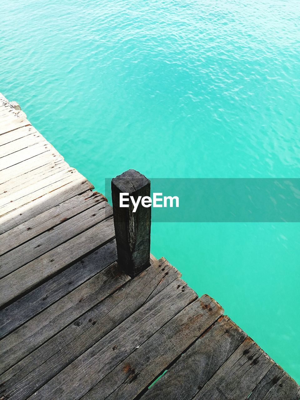 High angle view of wooden pier over sea