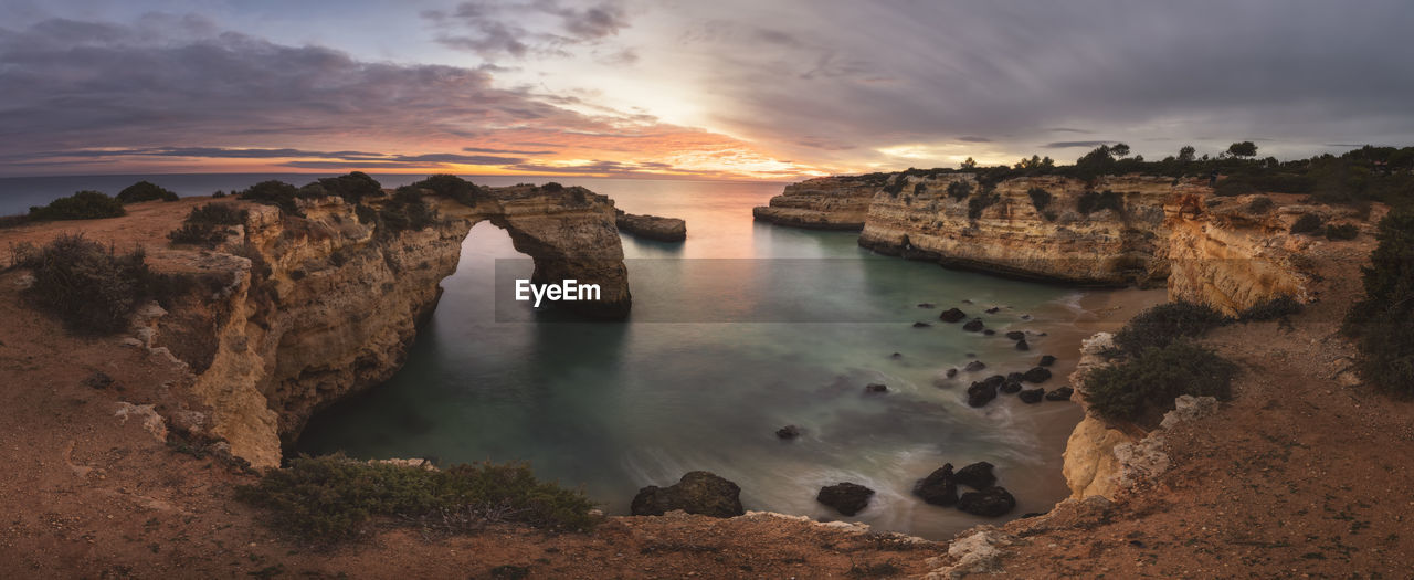 Sunset in algarve cliffs in panoramic from aerial view