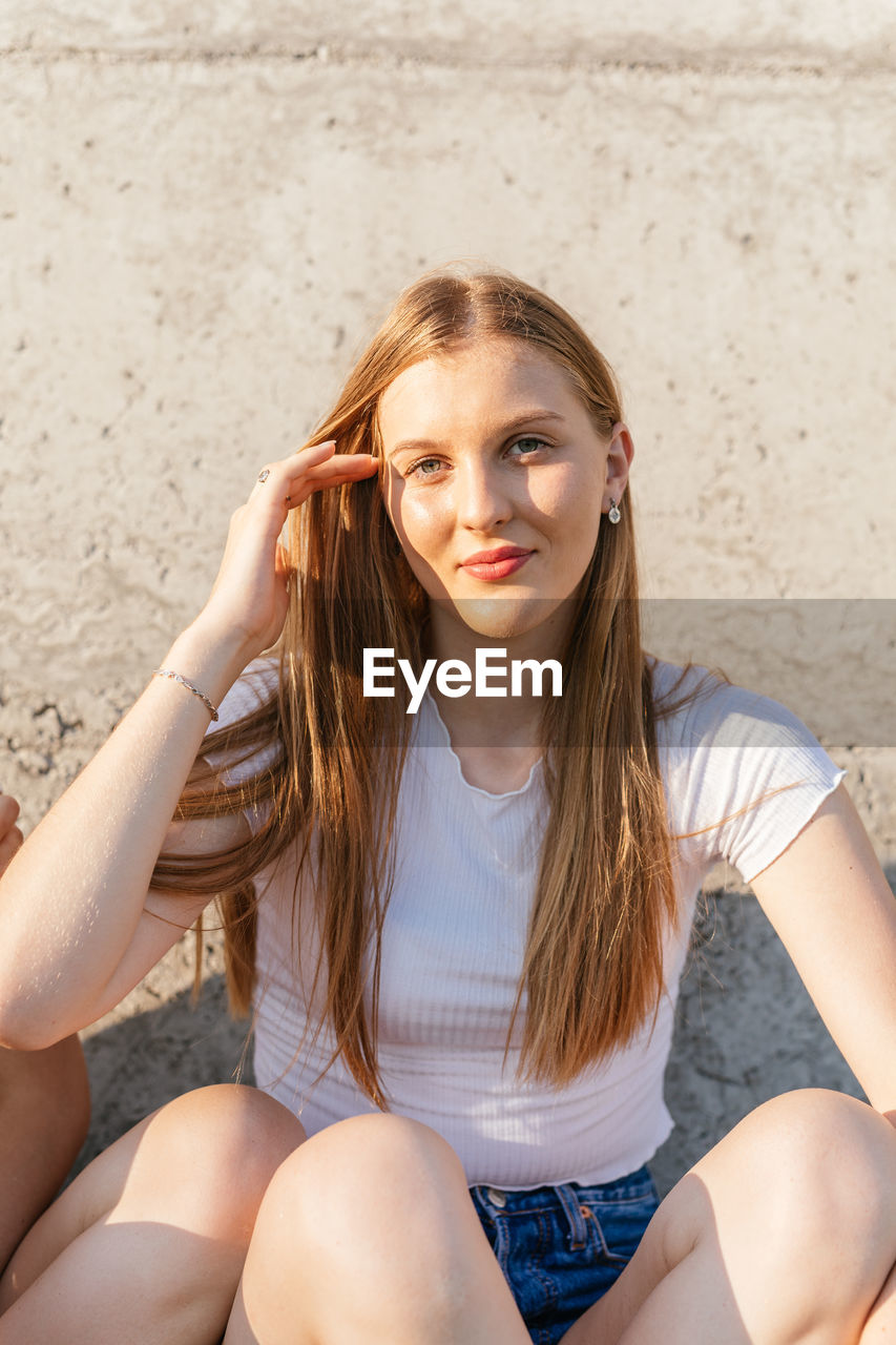 Portrait of a beautiful teenage girl smiling and looking at camera
