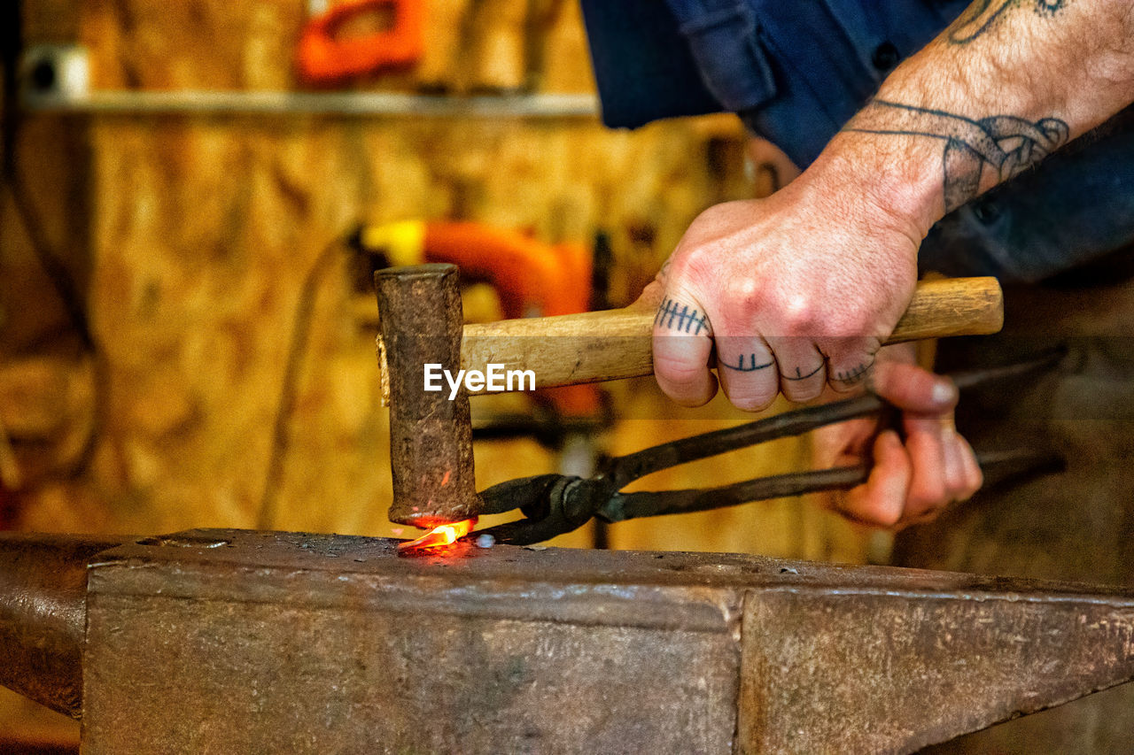 Man working on anvil in the forge