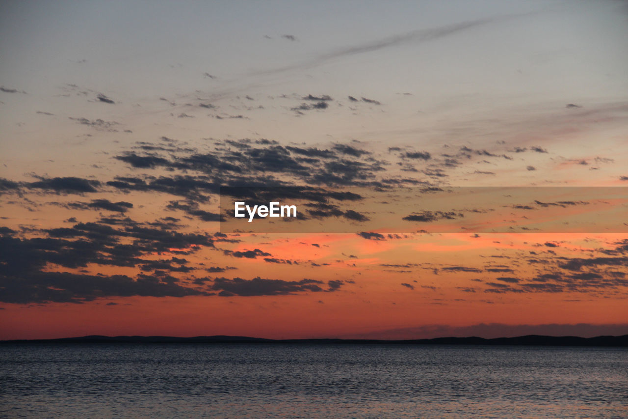 sky, sunset, water, beauty in nature, sea, cloud, scenics - nature, nature, tranquility, horizon, dramatic sky, afterglow, tranquil scene, orange color, ocean, horizon over water, dawn, no people, environment, evening, land, beach, idyllic, landscape, animal, outdoors, animal themes, seascape, animal wildlife, coast, travel destinations, wildlife, sun, reflection, silhouette, travel, shore, red sky at morning, bird, romantic sky