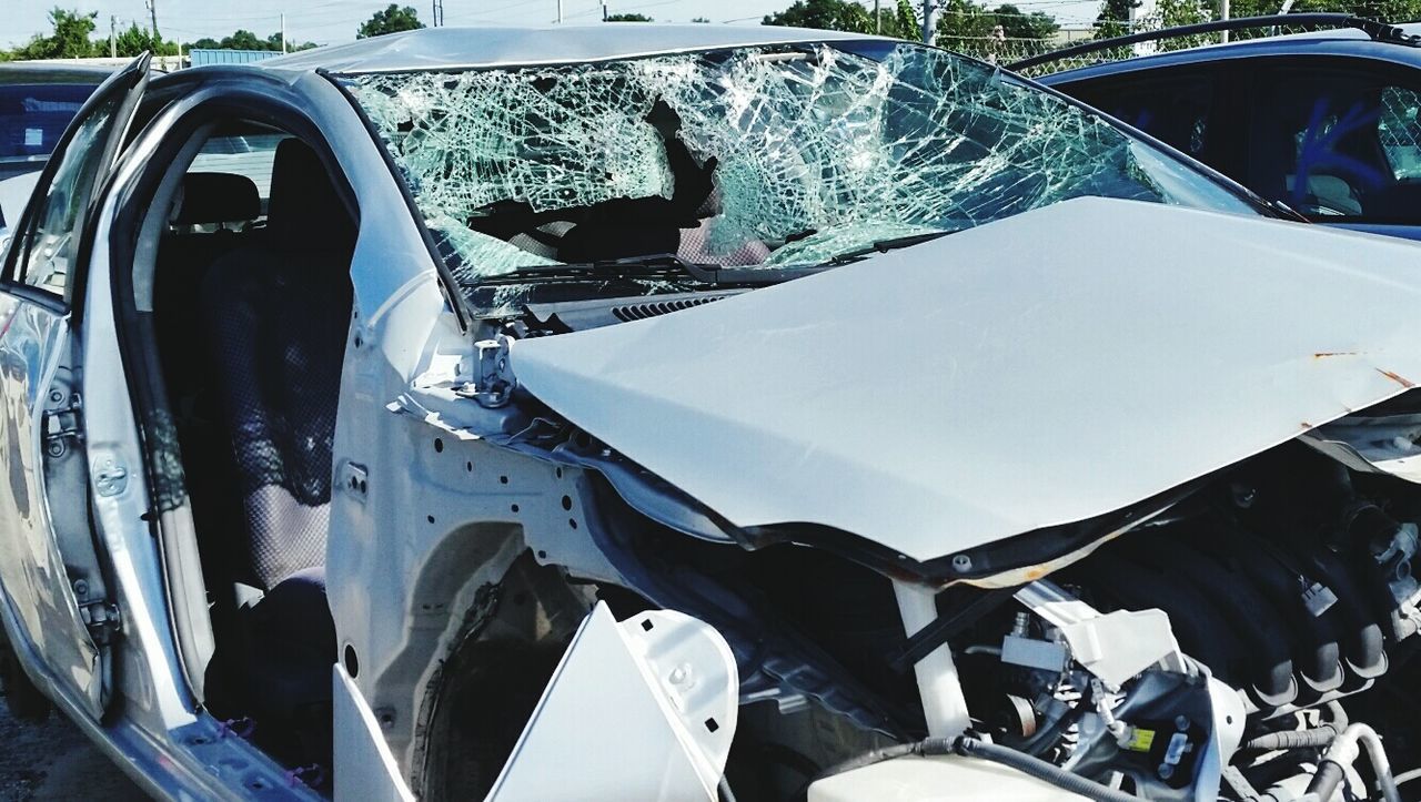 Damaged car in parking lot