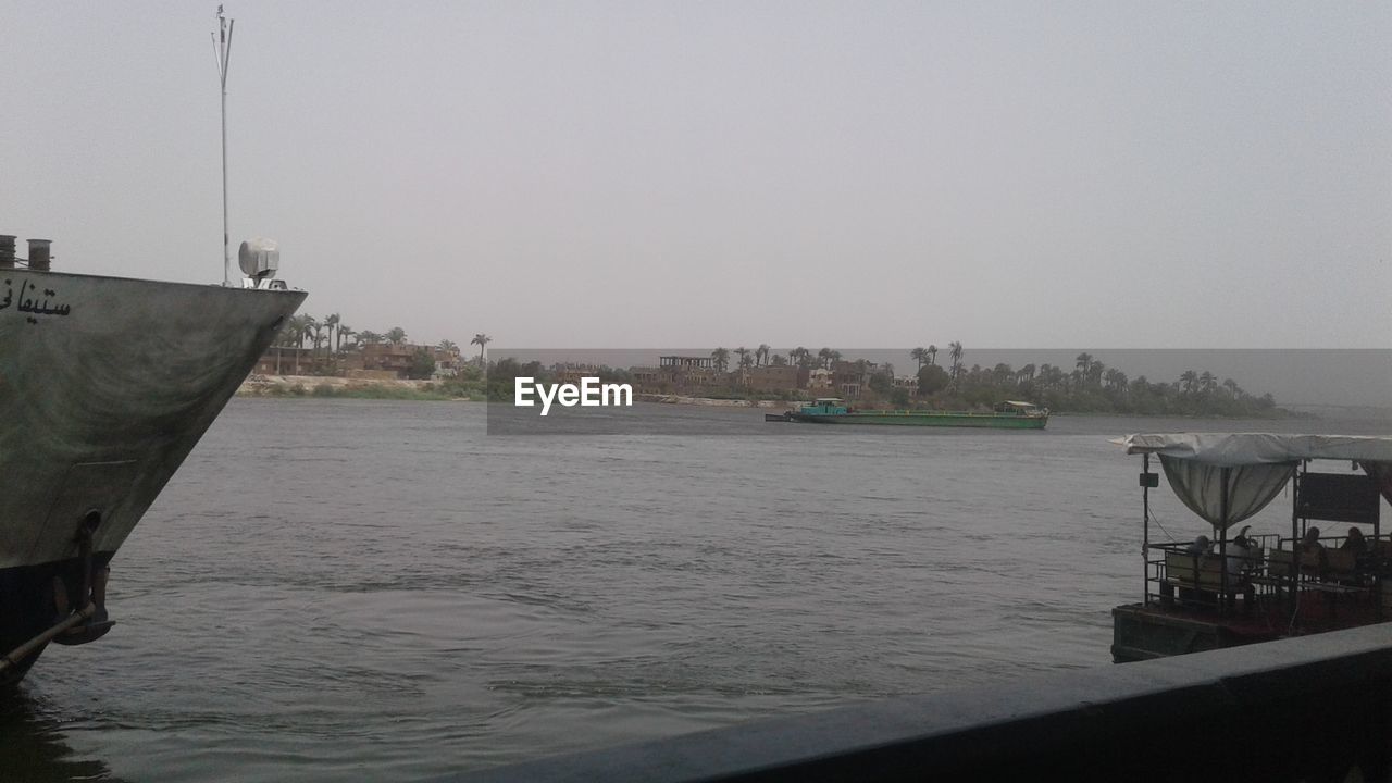 VIEW OF BOATS IN SEA