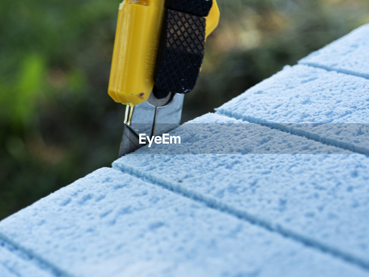 Cut a piece of polypropylene heater with a construction knife