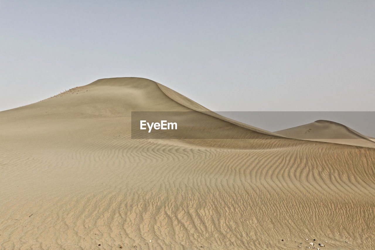 Scenic view of desert against clear sky