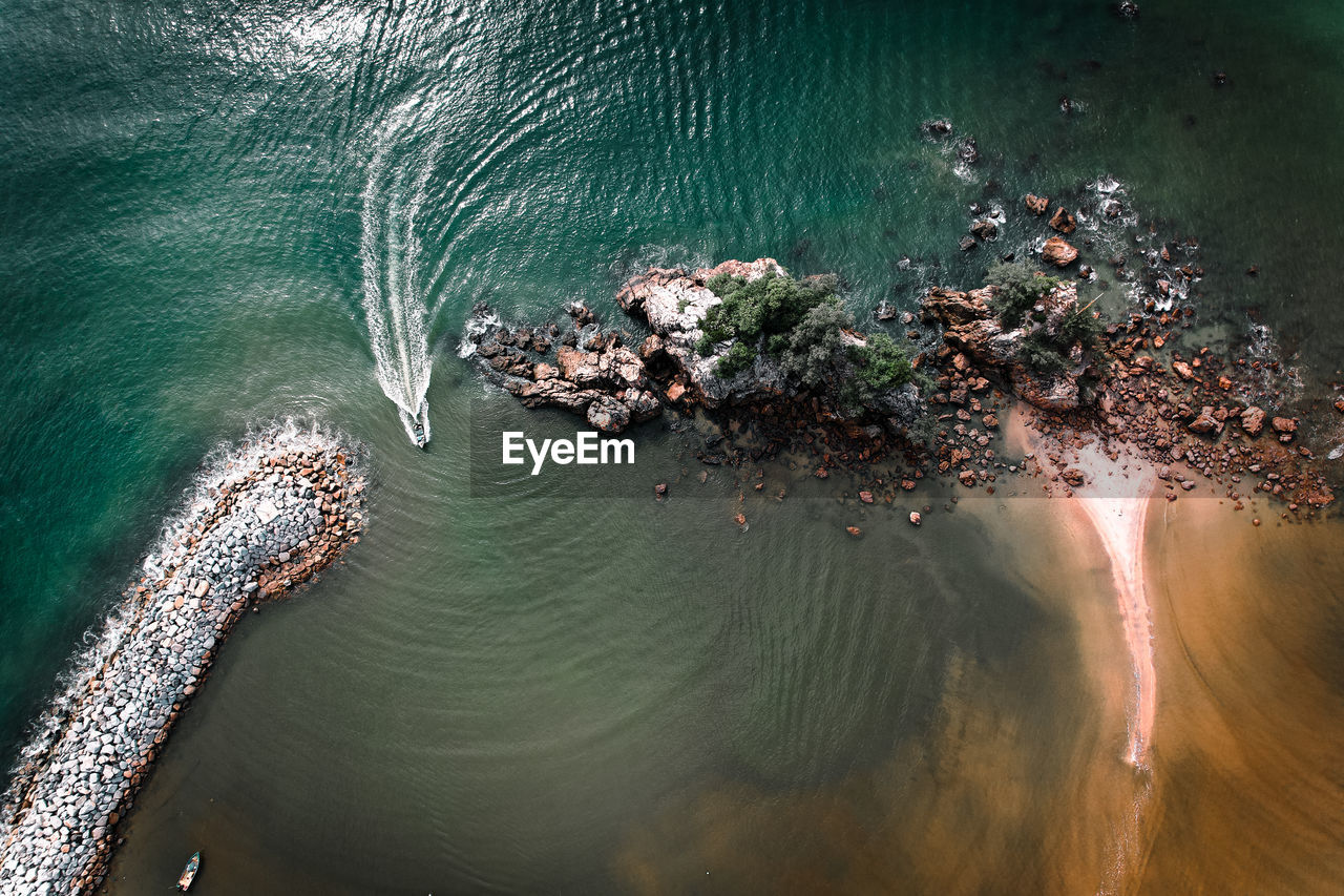 high angle view of rocks on lake