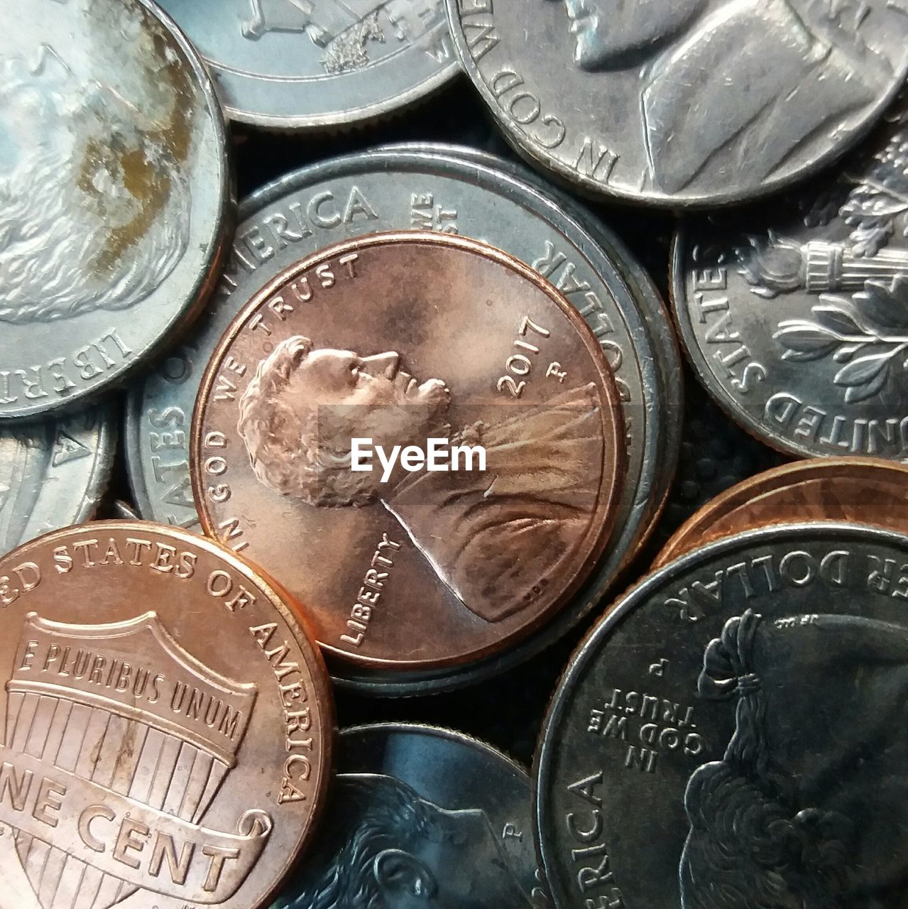 FULL FRAME SHOT OF COINS ON METAL