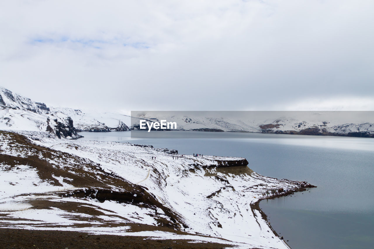 scenic view of snow covered mountains against sky