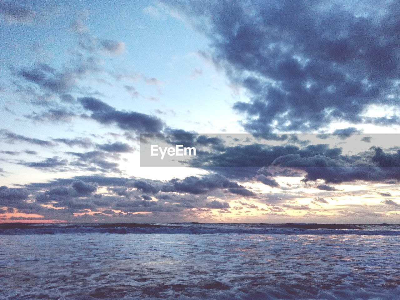Scenic view of sea against sky at sunset