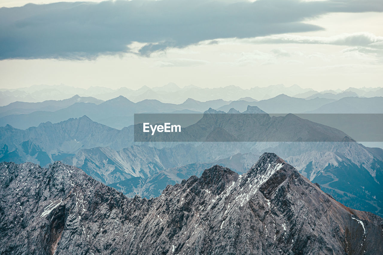 Aerial view of mountain range against sky