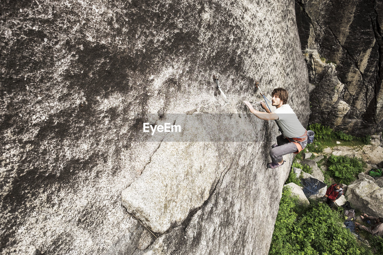 High angle view of man rock climbing