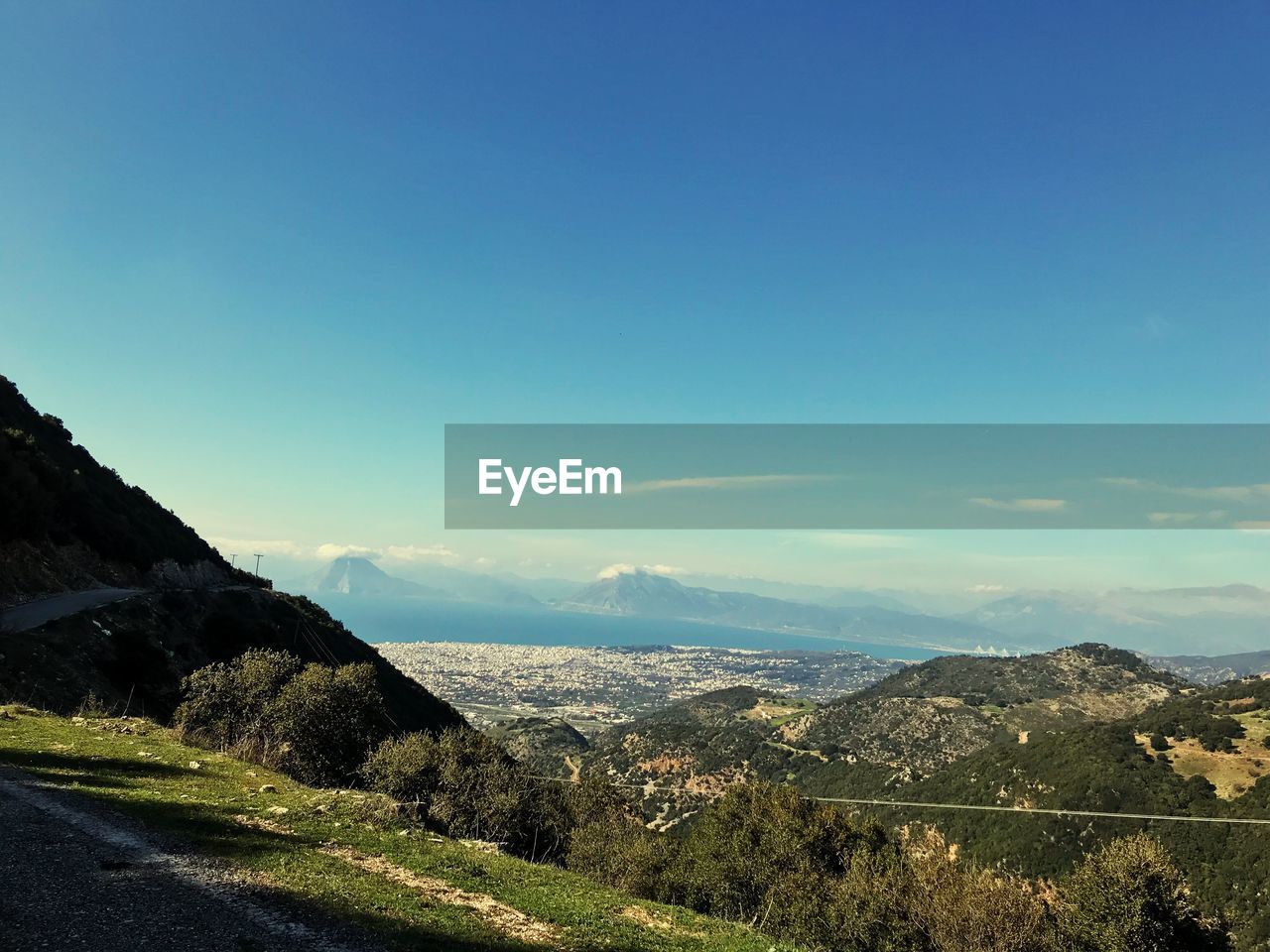 Scenic view of landscape against blue sky