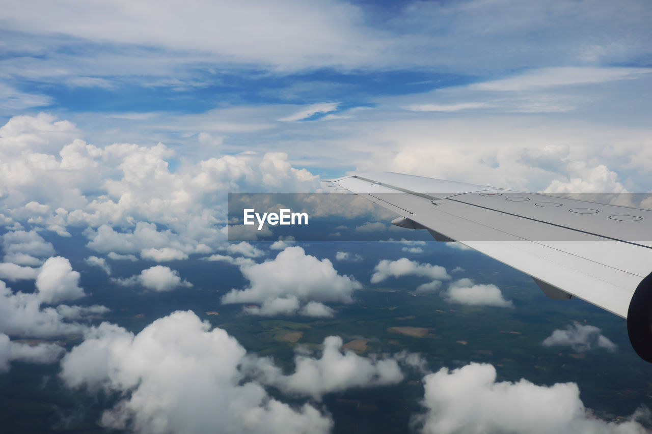 Aerial view of airplane flying over landscape