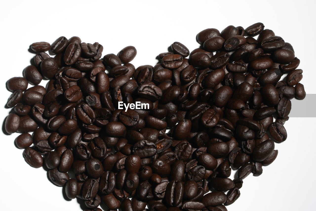 CLOSE-UP OF COFFEE BEANS IN BACKGROUND
