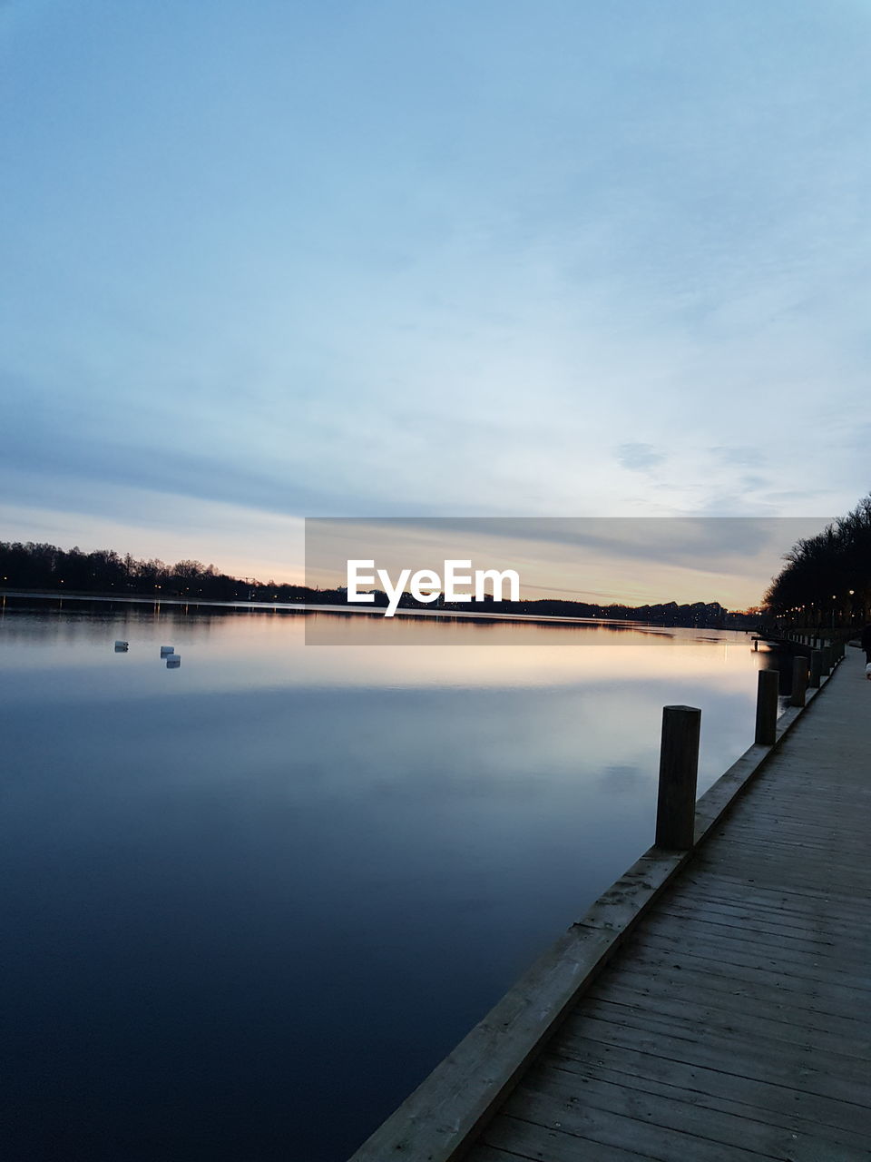 PIER OVER LAKE AGAINST SKY