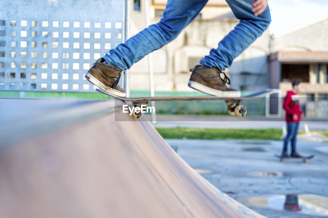 Close up view of skateboard on skateramp coping