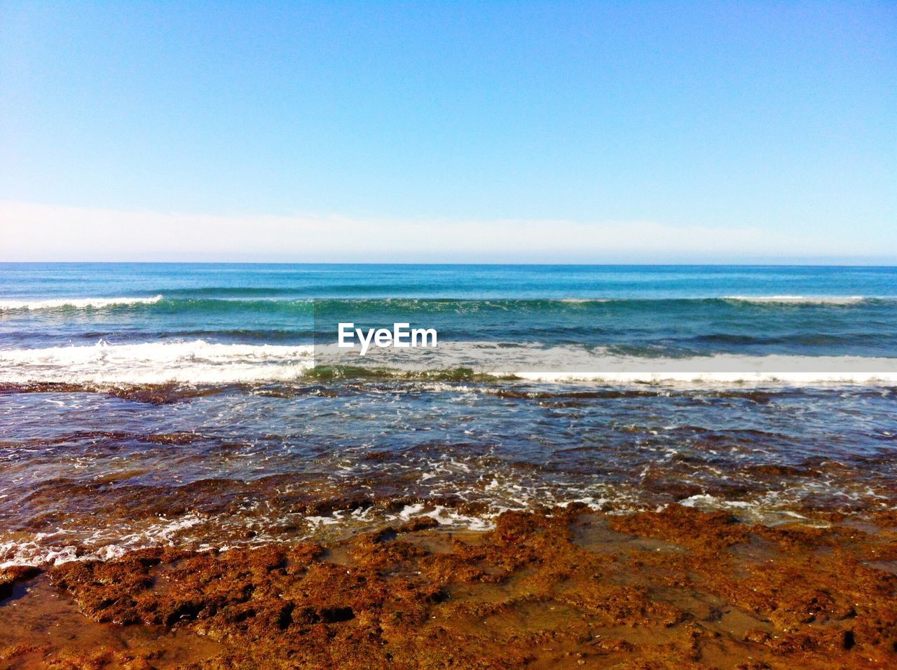 Scenic view of sea against clear sky