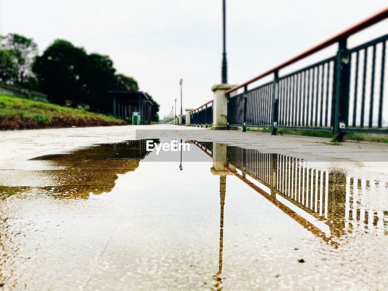 REFLECTION OF BRIDGE IN WATER