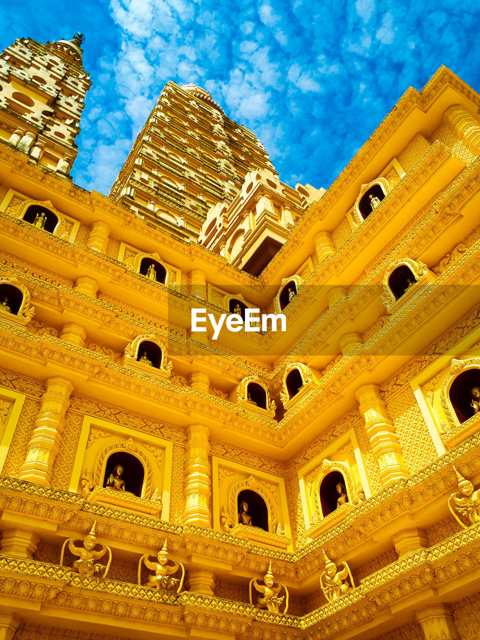 LOW ANGLE VIEW OF BUILDING AGAINST BLUE SKY