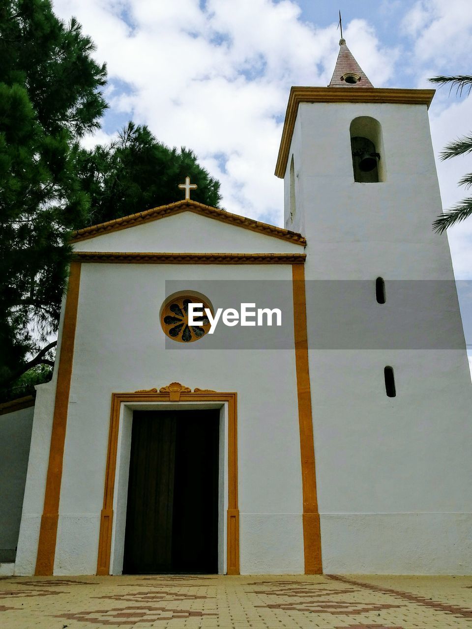 LOW ANGLE VIEW OF BELL TOWER AGAINST BLUE SKY